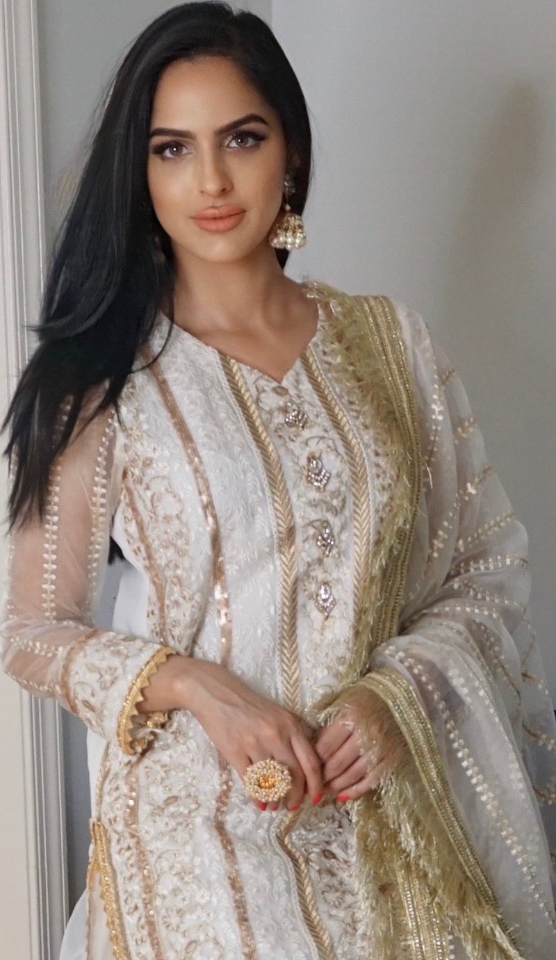 Intricate gold embroidery Pakistani suit. Comes with salwar and matching dupatta. 